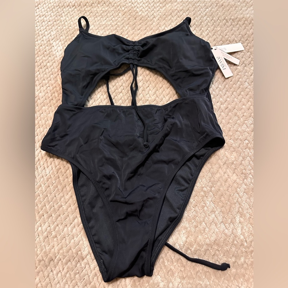 One piece swimsuit with cut out and adjustable ties. Victoria’s Secret swim